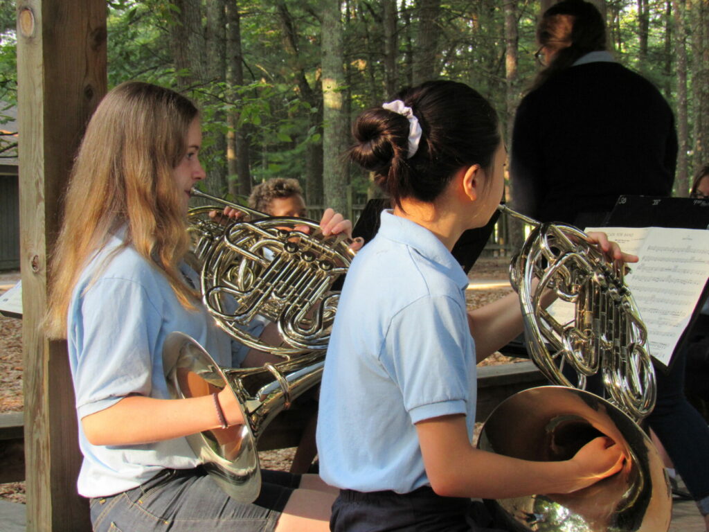 Teen girls playing in the band at Blue Lake Fine Arts Camp